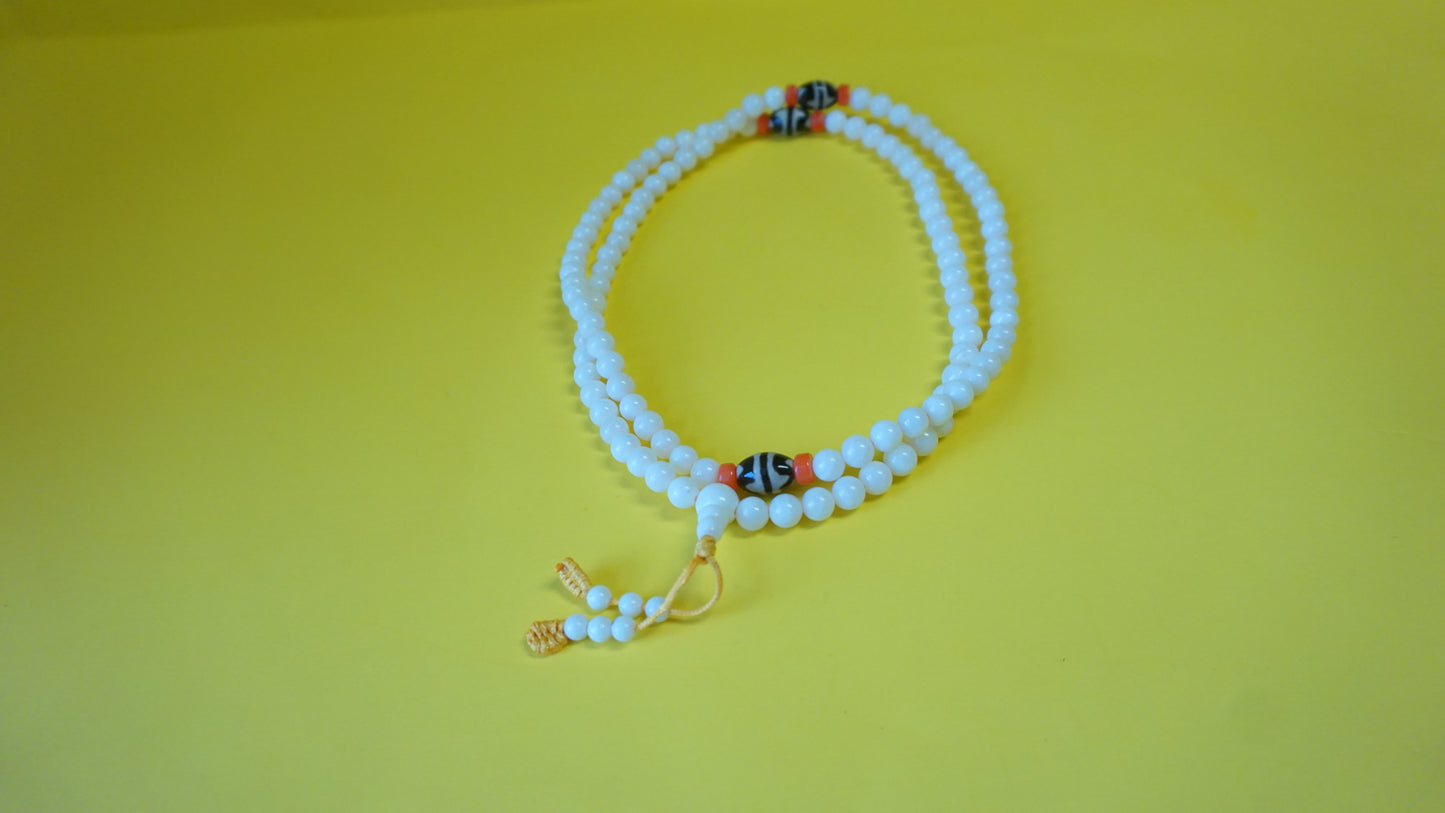 Small White Coral Smoot Bead.